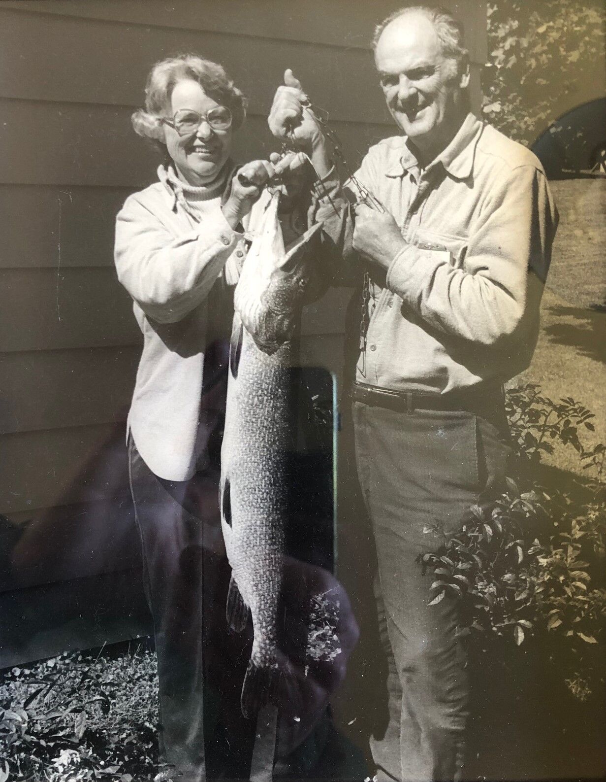 fishers hold up a pike